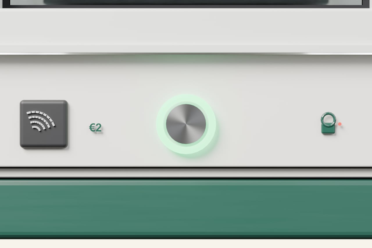 One compartment's controls: a contactless pad marked €2, a round start button with a mint status ring and a small lock indicator